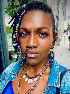 Evita Sawyers in a denim shirt.